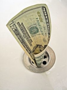 money down the drain from leak
