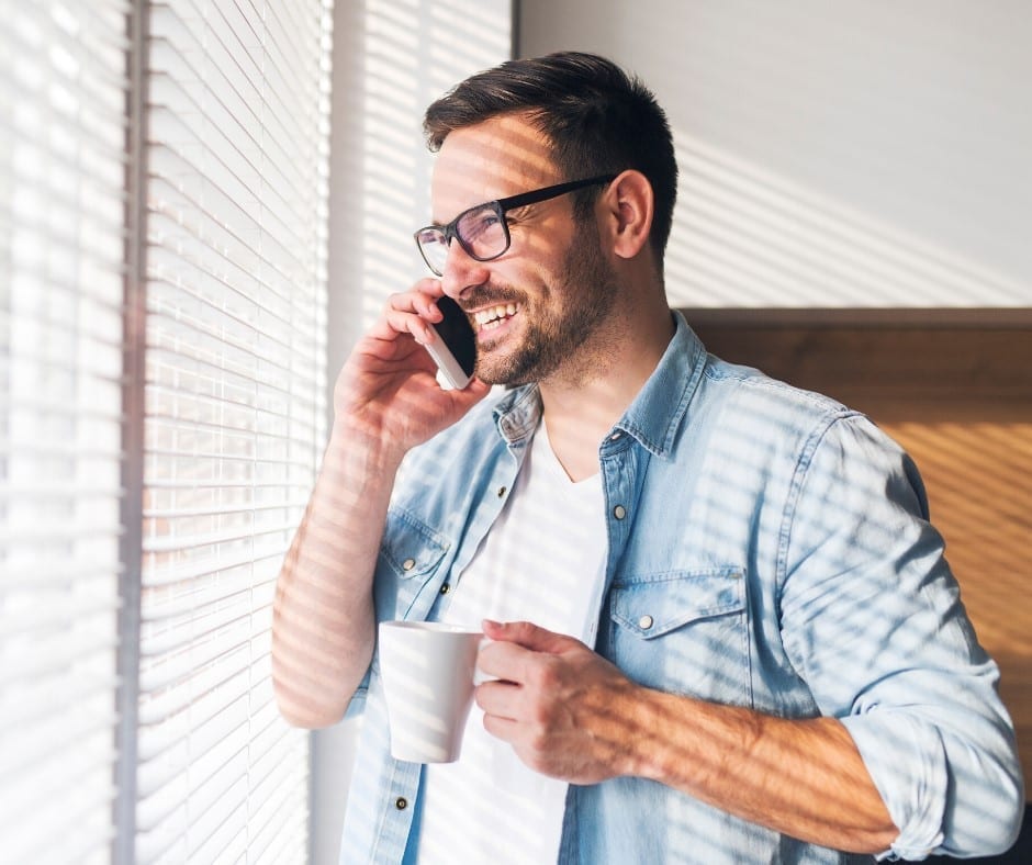 Man on the phone with coffee