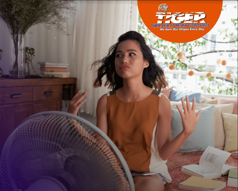 Girl sitting in front of fan