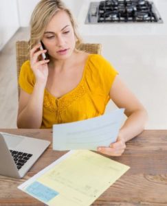 woman looking at bill